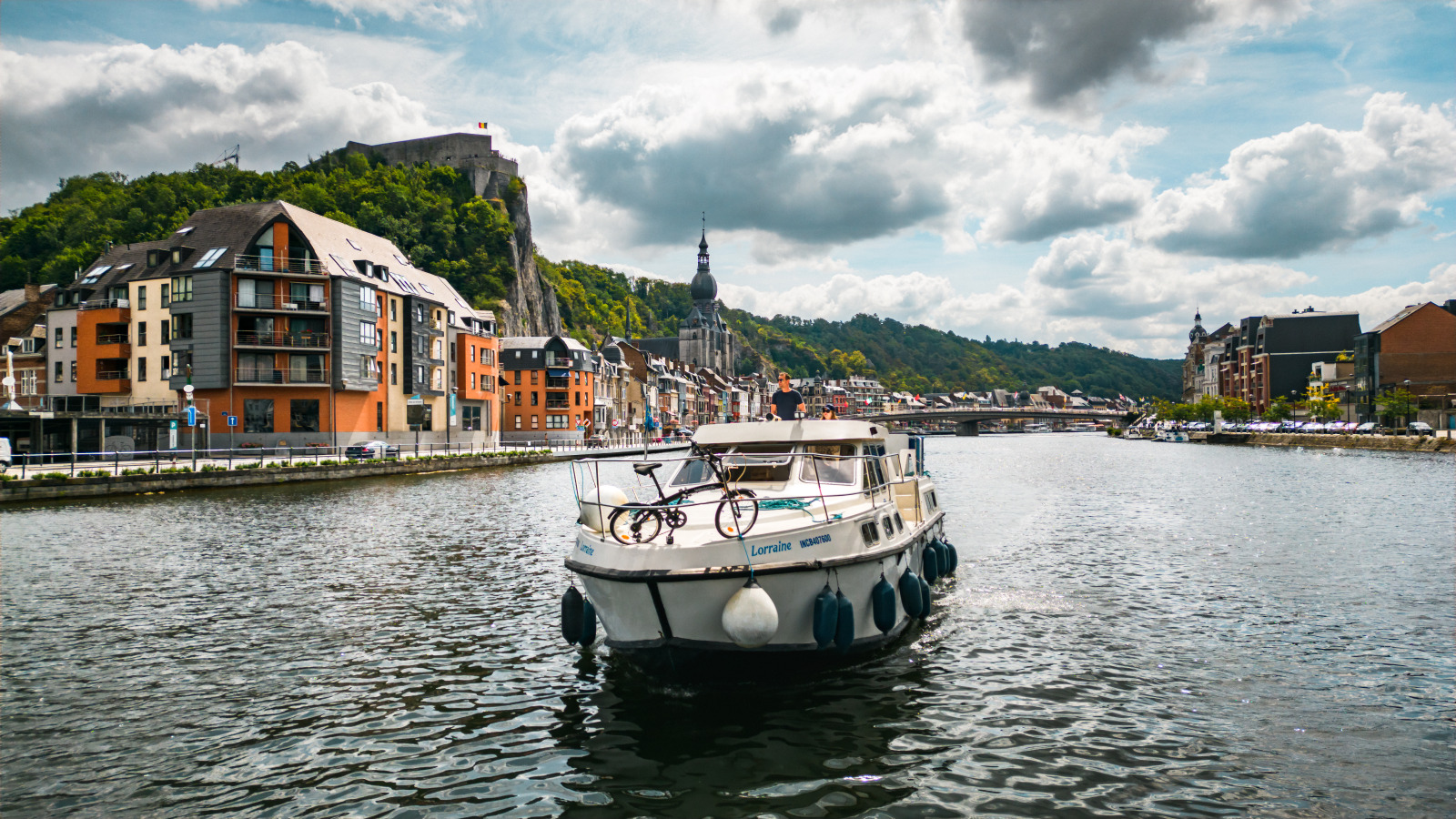 Narrowboat, no license required, on the Meuse river in Dinant