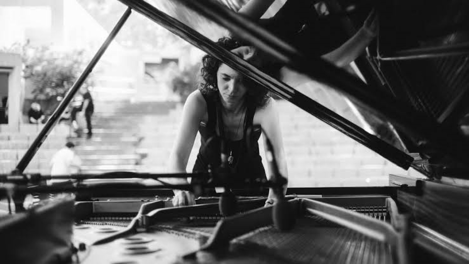 Woman tuning a piano