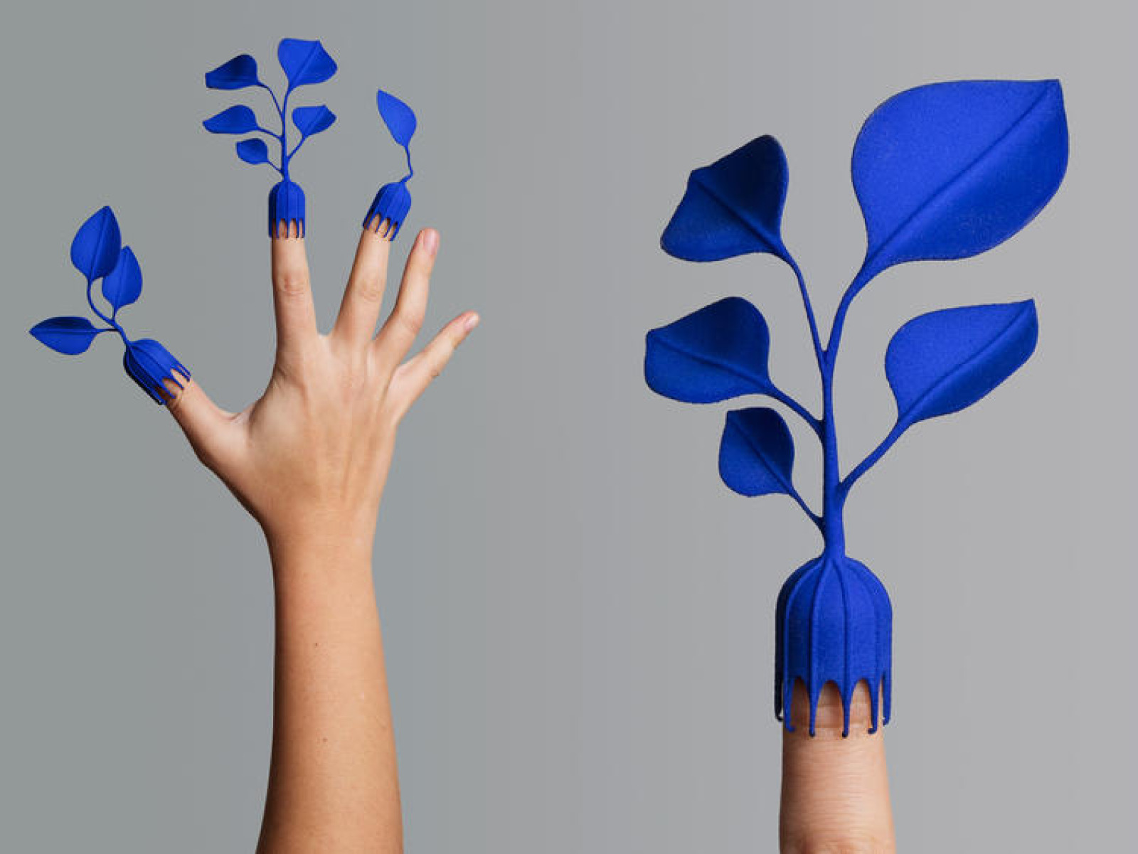 Fingers whose ends are decorated with blue leaves