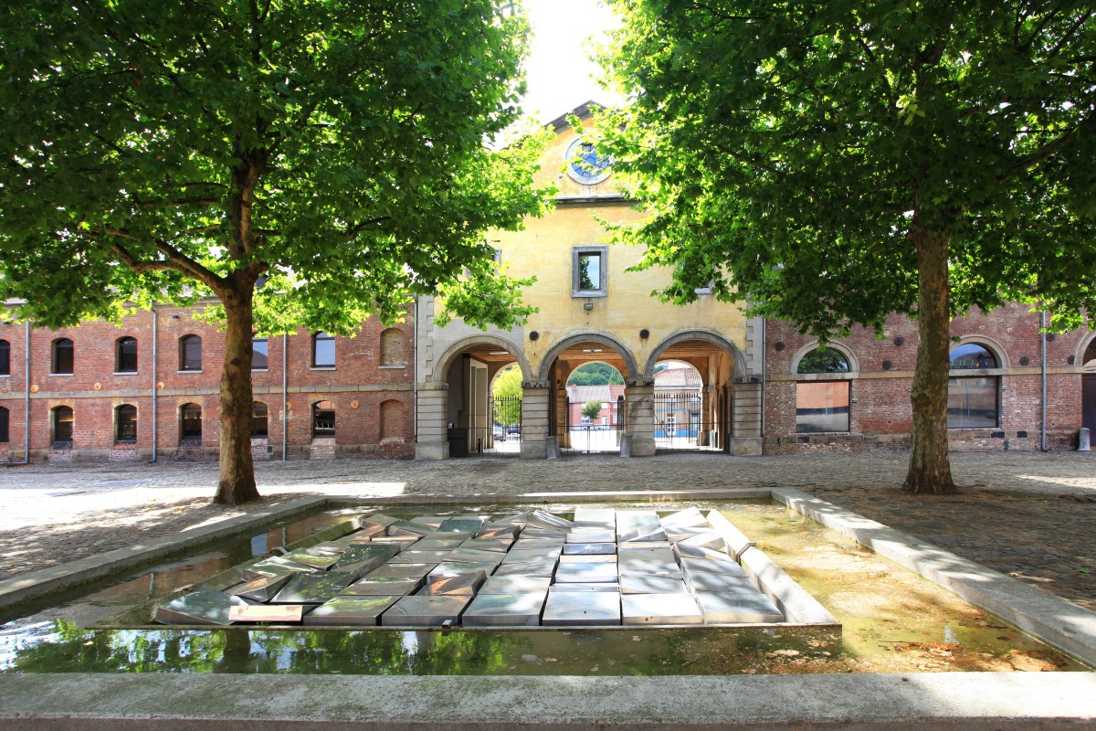 Interior courtyard with trees at the Grand-Hornu site