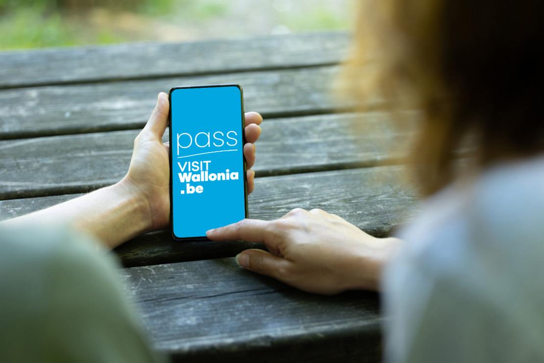 Smartphone screen featuring the VISITWallonia Pass logo