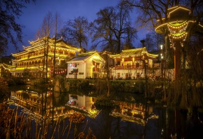 Chinese temple illuminated with thousands of garlands
