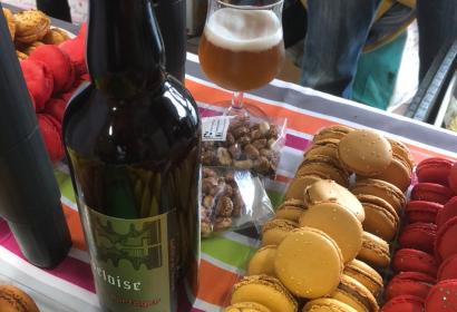 Beers and macarons placed on a table for tasting