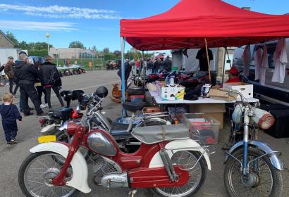 Stall presenting vintage motorcycles and accessories