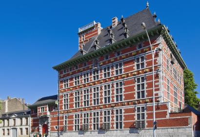Façade of the Grand Curtius building under the blue sky